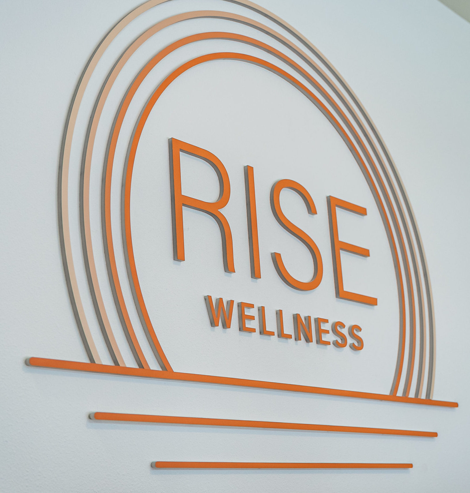 Rise Modern Wellness reception logo wall